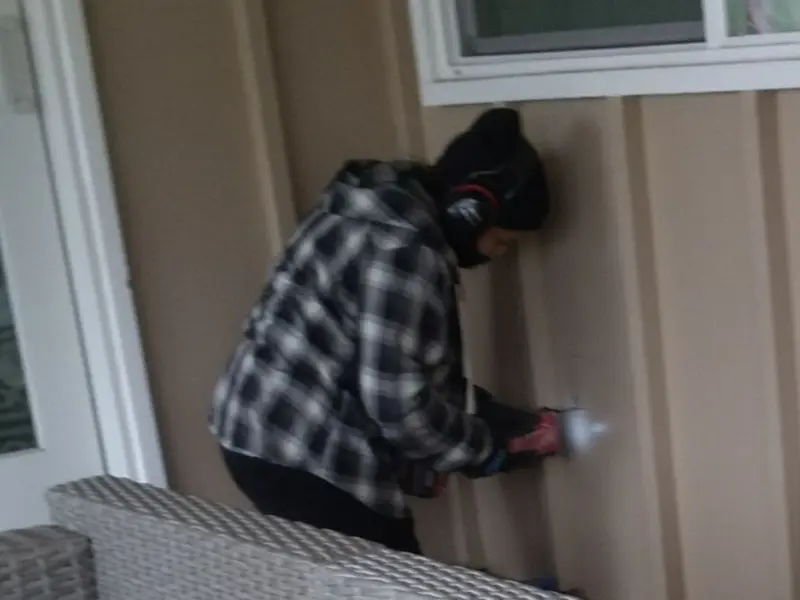 Professional electrician installing an exterior outlet in Roanoke