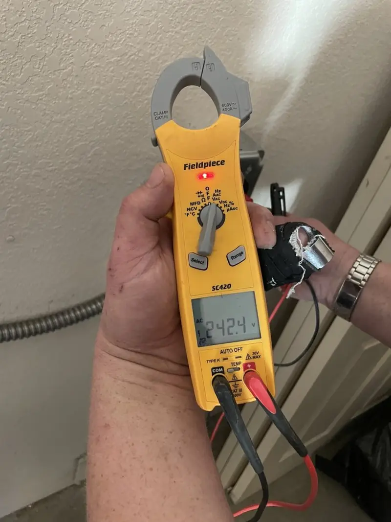 Voltage testing with clamp meter during Ceiling Fan Installation in Roanoke